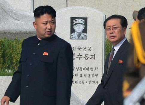 Kim Jong Un is said to have removed his uncle Jang Song Taek (R) from office