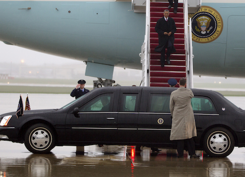 President Barack Obama walks down the stairs of Air Force One upon his arrival in the rain at Andrews Air Force Base / AP
