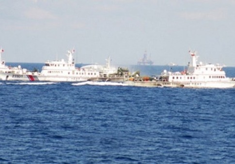 Chinese maritime patrol ships block a Vietnamese vessel near a Chinese oil rig in South China Sea