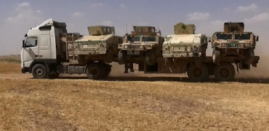 U.S.-made Humvees enroute from Iraq to Syria