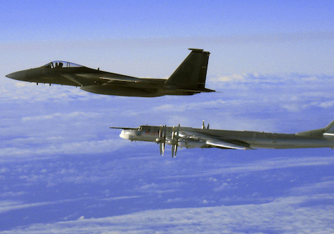 This Thursday, Sept. 28, 2006 file photo provided by the U.S. Air Force shows an F-15C Eagle from the 12th Fighter Squadron at Elmendorf Air Force Base in Anchorage, Alaska, flying next to a Russian Tu-95 "Bear" bomber, right, during a Russian exercise which brought the bomber near the west coast of Alaska