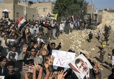 Supporters of Egypt's ousted President Mohammed Morsi chant slogans during a demonstration in Dalga Village, in upper Egypt, Friday, Aug. 30, 2013