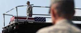 A transfer case containing the remains of Army 1st Lt. Michael L. Runyan sits on a loader Saturday, July 24, 2010 at Dover Air Force Base, Del. Runyan died in Iraq of injuries sustained when insurgents attacked his convoy vehicle with an improvised explosive / AP
