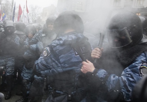 Riot police react after a pepper spray is released into the crowd during a rally in support of EU integration in Kiev