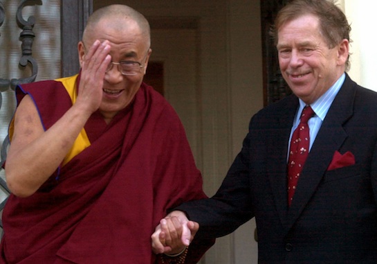 The Dalai Lama, left, and Czech President Vaclav Havel hold hands in front of Havel's private residence in Prague