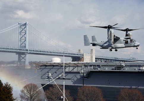 A Marines Osprey lands aboard the USS Somerset in view of the Benjamin Franklin Bridge