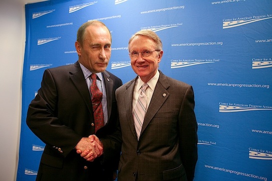 Reid greets Putin at a recent event hosted by the Center for American Progress.