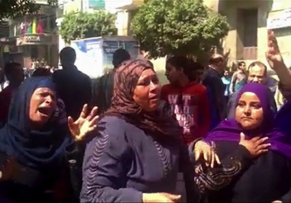 This image made from video shows relatives reacting after an Egyptian court on Monday sentenced to death 529 supporters of ousted Islamist President Mohammed Morsi
