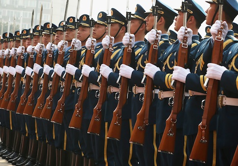 Chinese honor guards stand to attention