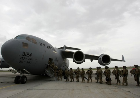 U.S. servicemen from Bravo Company, 234 Battalion 1st Infantry Division, board a plane bound for Afghanistan at the U.S. transit center at Manas airport near Bishkek
