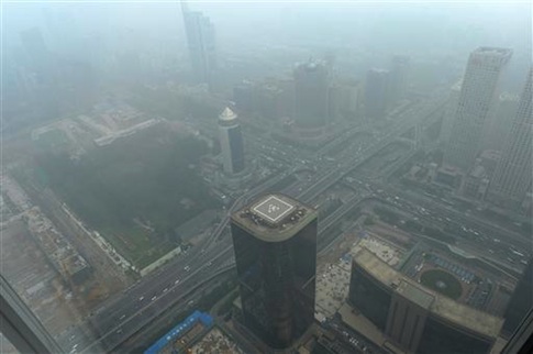 View of high-rise buildings in heavy smog in Beijing, China, July 3