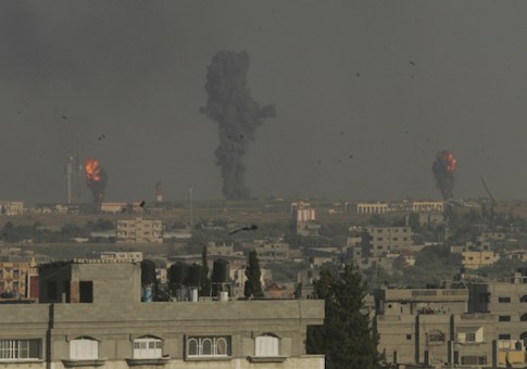 Smoke and flames are seen following what witnesses said were Israeli air strikes in Rafah in the southern Gaza Strip July 7, 2014
