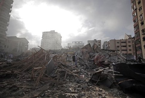 Rubble of the Al-Zafer apartment tower following Israeli airstrikes Saturday