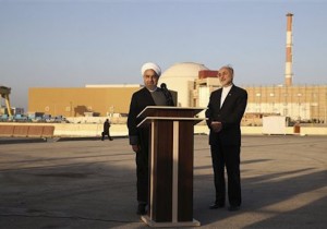In this photo released by the Iranian Presidency Office, President Hassan Rouhani, left, speaks as he is accompanied by the head of Iran's Atomic Energy Organization Ali Akbar Salehi during his visit to the Bushehr nuclear power plant just outside the port city of Bushehr, southern Iran, Tuesday, Jan. 13