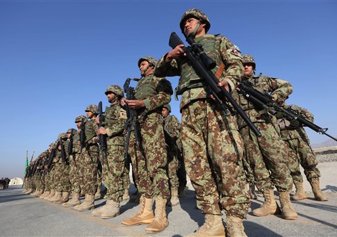 Afghan security forces attend a ceremony in Laghman province, east of Kabul, Afghanistan, Sunday, Jan. 11, 2015