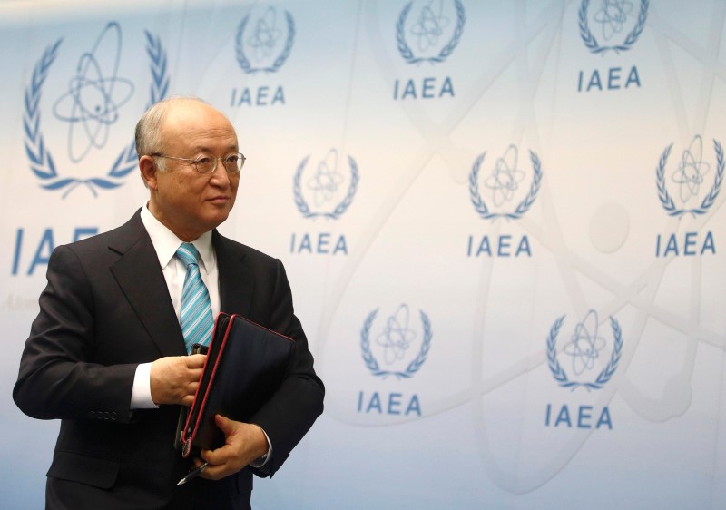 IAEA Director General Amano leaves a news conference after a board of governors meeting at the IAEA headquarters in Vienna