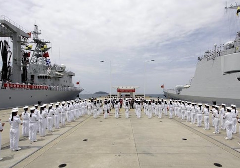 Chinese navy sailors stand in formation as they attend a send-off ceremony before departing for the Rim of the Pacific exercise, at a military port in Sanya