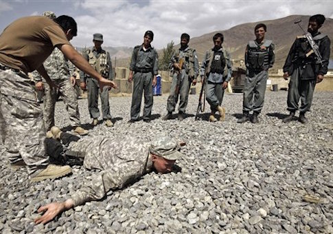 U.S. Army Sgt. William Womack, 23, from Batesville, Ga., of the 118th Military Police Co., based at Fort Bragg, N.C., is prone during a training session for the Afghan National Police at a combat outpost in the Jalrez Valley in Afghanistan's Wardak Province