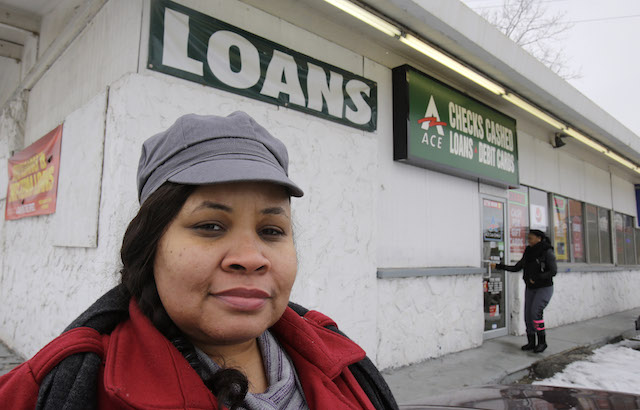 Maranda Brooks stands outside a payday loans business that she frequented in the past Thursday, Jan. 22, 2015, in Cleveland. Troubled by consumer complaints and loopholes in state laws, federal regulators are putting together expansive, first-ever rules on payday loans aimed at helping cash-strapped borrowers from falling into a cycle of high-rate debt. Analysts often point to Ohio for its complicated history with payday loans: Ranking fourth in the nation in the share of people who took out payday loans, at 10 percent, Ohio also was third among states in the number of consumer complaints to the CFPB about payday loans, behind Texas and California. (AP Photo/Tony Dejak)