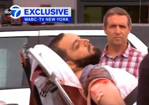 A still image captured from a video from WABC television shows a conscious man believed to be New York bombing suspect Ahmad Khan Rahami being loaded into an ambulance after a shoot-out with police in Linden