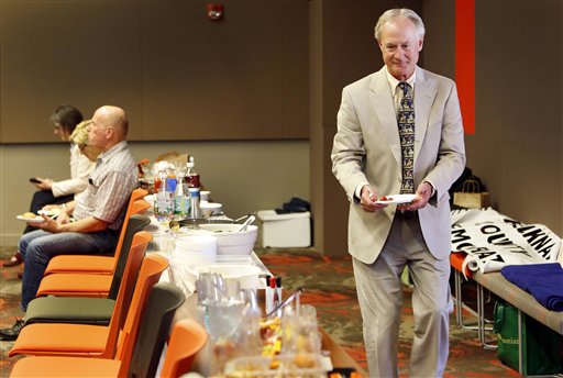 Democratic presidential candidate former Rhode Island Gov. Lincoln Chafee grabs a plate of food before speaking at the Belknap County Democrats meeting during a campaign stop Wednesday, June 24, 2015, in Laconia, N.H. (AP Photo/Jim Cole)