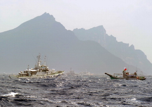 A Taiwan fishing boat and a Japan Coast Guard vessel are seen near the Senkaku islands