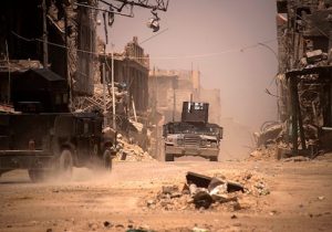Iraqi forces patrol a street in west Mosul on July 12, 2017 a few days after the government's announcement of the "liberation" of the embattled city from ISIS