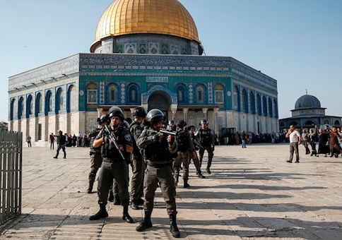 Israeli security forces in front of the Dome of the Rock in the Haram al-Sharif compound in the old city of Jerusalem after clashes erupted between Israeli police and Palestinians