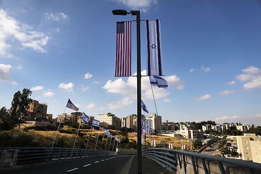 American and Israeli flags fly at the entrance to the new American embassy in Jerusalem