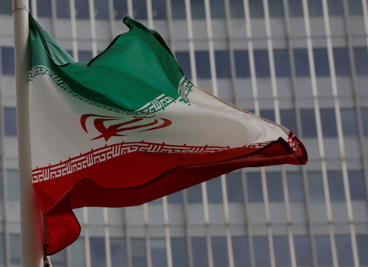 FILE PHOTO: An Iranian flag flutters in front of the IAEA headquarters in Vienna