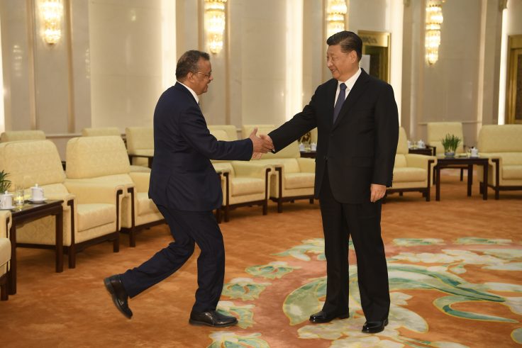 World Health Organization director general Tedros Adhanom shakes hands with Chinese president Xi Jinping