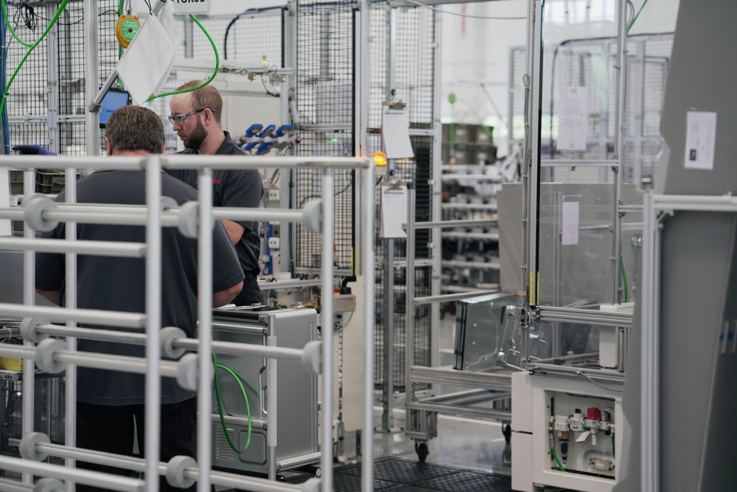 Workers are pictured on the plant's assembly line.